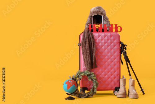 Suitcase with winter and tr...