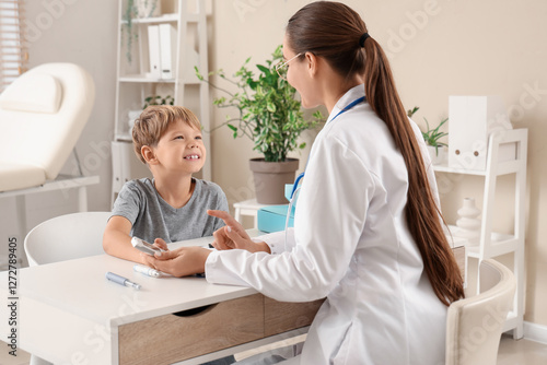 Little diabetic boy with do...