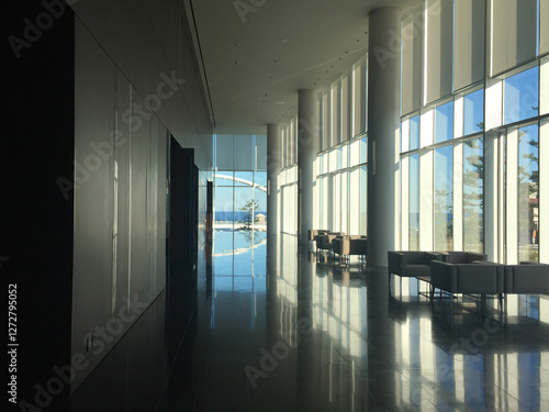 A well-designed architectural interior of a spacious lobby that appears upon entering a building.