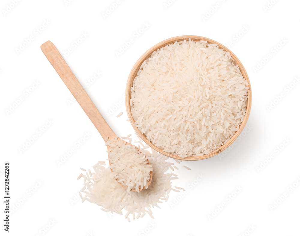 Wooden bowl and spoon with raw rice isolated on white background, top view Wooden bowl and spoon with raw rice isolated on white background, top view