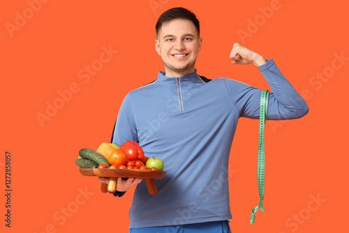 Sporty young man with measu...
