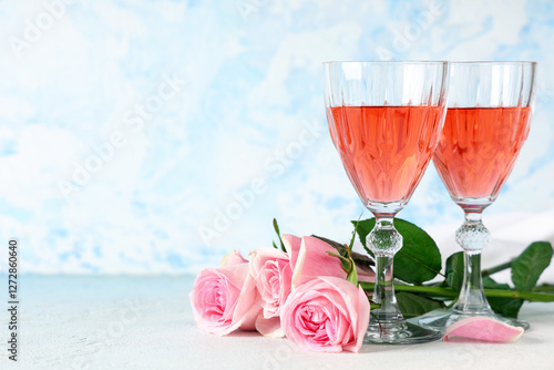 Glasses of pink wine and be...