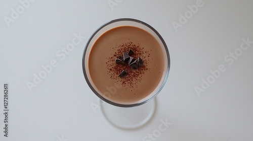 Chocolate mousse dessert, overhead, white background, cocoa garnish photo