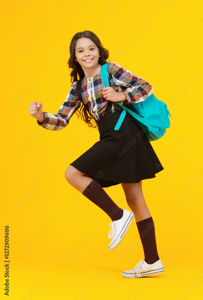 Study in college. Student girl hurry up with backpack. Back to school. Knowledge day. Knowledge and education. School education. Student in a hurry. Young happy girl isolated on yellow. Autumn time Study in college. Student girl hurry up with backpack. Back to school. Knowledge day. Knowledge and education. School education. Student in a hurry. Young happy girl isolated on yellow. Autumn time