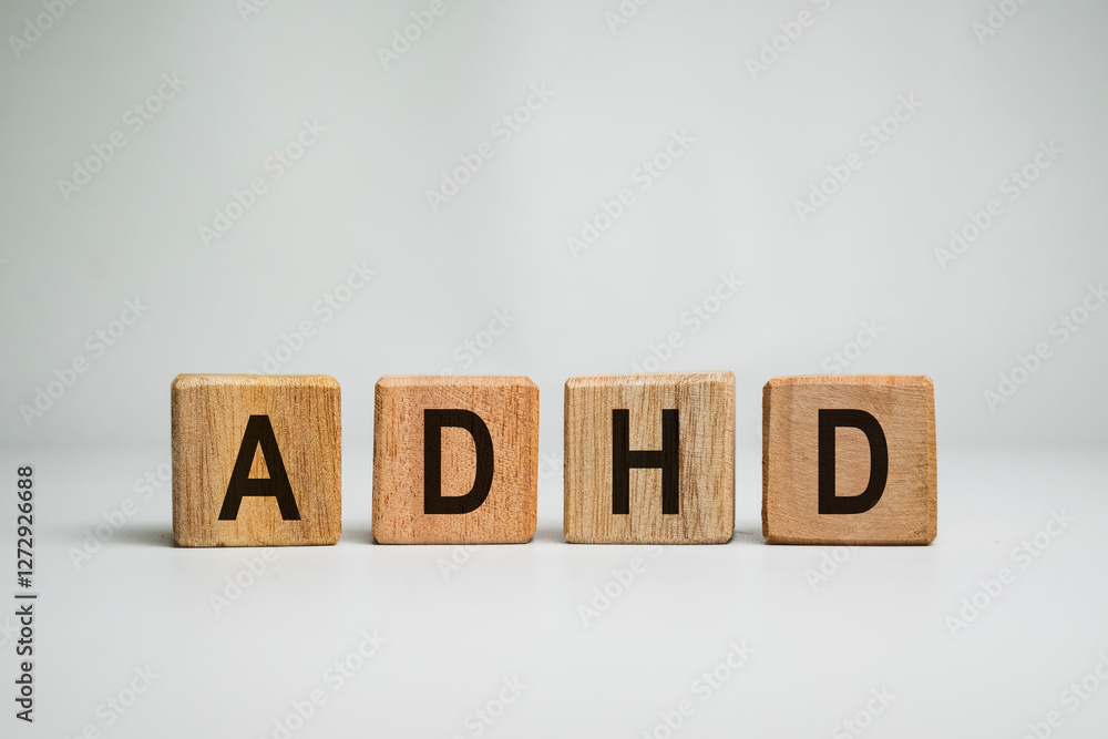 Obraz premium ADHD or attention deficit hyperactivity disorder text letter message on wooden cube isolated on white background