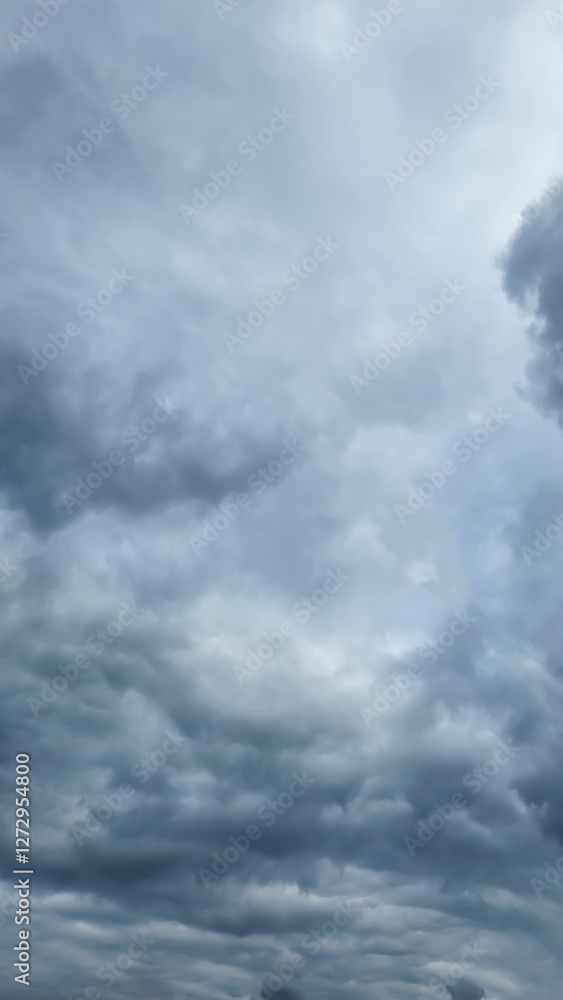Blue sky with clouds, winter weather. Clouds on the background of trees. Blue sky with clouds, winter weather. Clouds on the background of trees.
