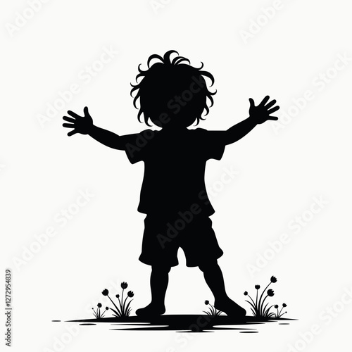 Silhouette of child with arms outstretched in grassy field