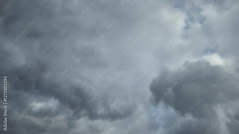 Blue sky with clouds, winter weather. Clouds on the background of trees. Blue sky with clouds, winter weather. Clouds on the background of trees.