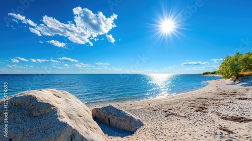 Beautiful sunny day at a white sandy beach with rocks