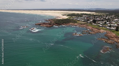 Anna Bay Point Lookout And Stockton Beach Sand Dunes On Sunny Day In Anna Bay, NSW, Australia. aerial sideways shot photo