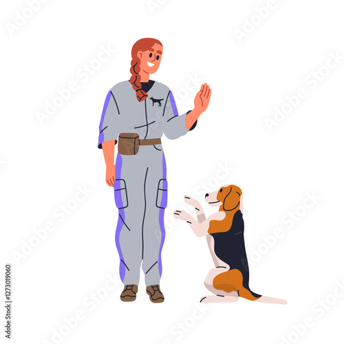 Dog standing on hind legs during training. Canine animal handler, trainer giv...
