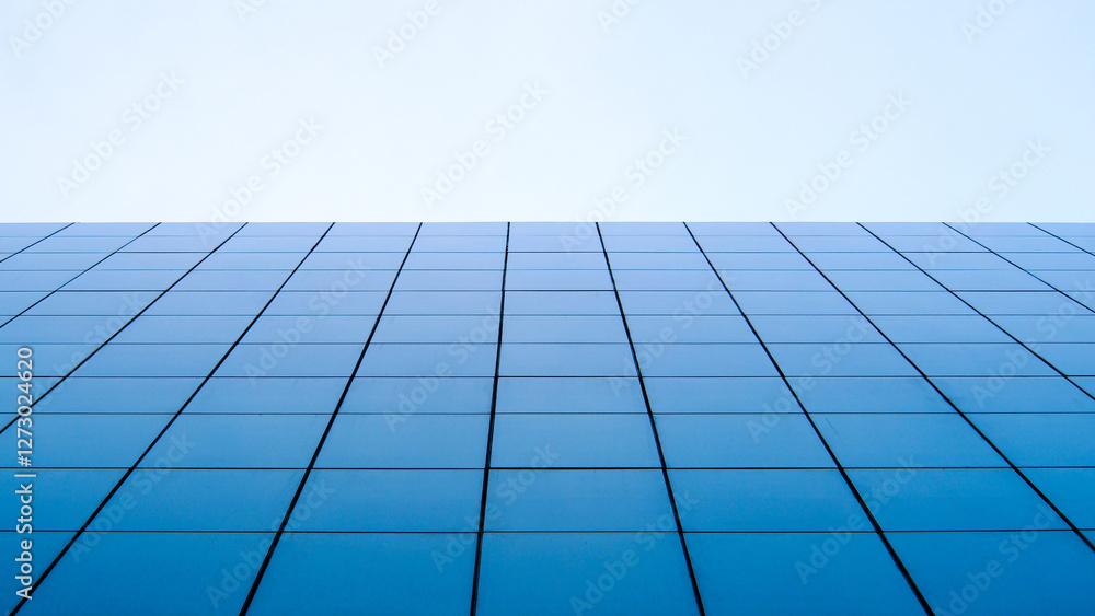 A minimalist perspective of a modern glass facade, capturing the perfect symmetry of blue-tinted windows stretching towards a clear, pale sky A minimalist perspective of a modern glass facade, capturing the perfect symmetry of blue-tinted windows stretching towards a clear, pale sky