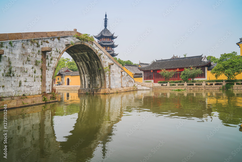 Fototapeta premium Old houses, rivers, and bridges in Zhouzhuang Ancient Town, Suzhou City, Jiangsu Province, China On April 18th, 2023