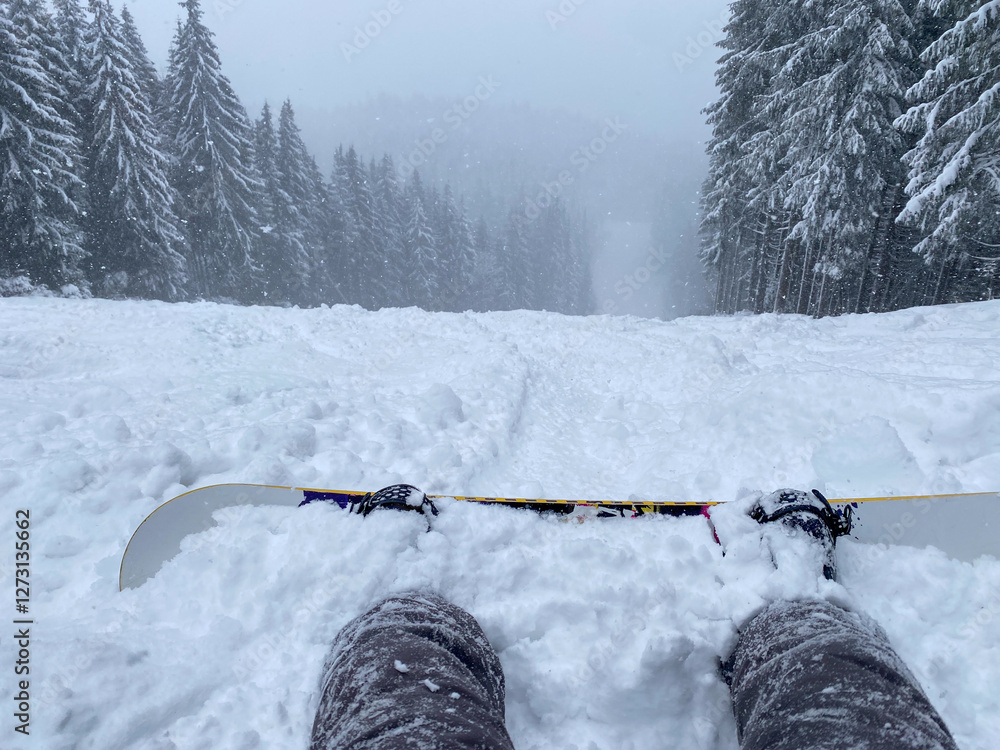 Snowy Ski Slope with Snowboard in Foreground