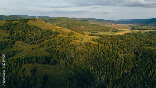 A river winding through mountains in Zakamensky District, Buryatia. Majestic peaks and serene natural beauty. photo