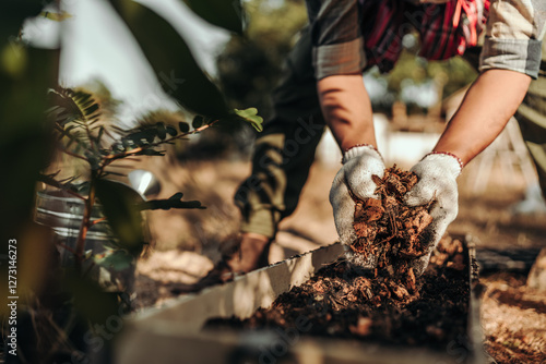 Gardeners are using coconut husks as a base for pots mixed with soil before planting vegetables. photo