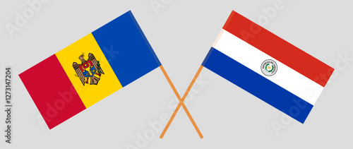 Crossed flags of Moldova and Republic of Paraguay. Official colors. Correct proportion. Vector illustration