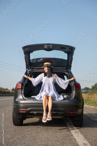 Obraz na płótnie Woman Enjoying a Sunny Day by Her Car w salonie