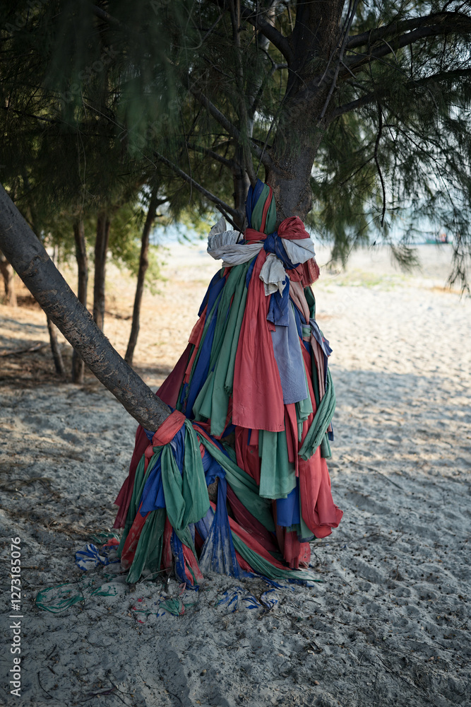 Sacred cloth tied to a tree in Thailand Sacred cloth tied to a tree in Thailand