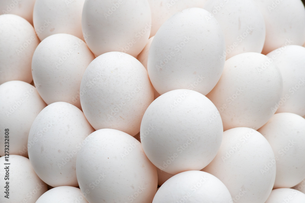 Lots of eggs on the counter in the store. White chicken eggs on wood chips. Easter. Lots of eggs on the counter in the store. White chicken eggs on wood chips. Easter.