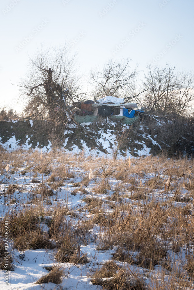 A camp of homeless people, hardships of life in winter.