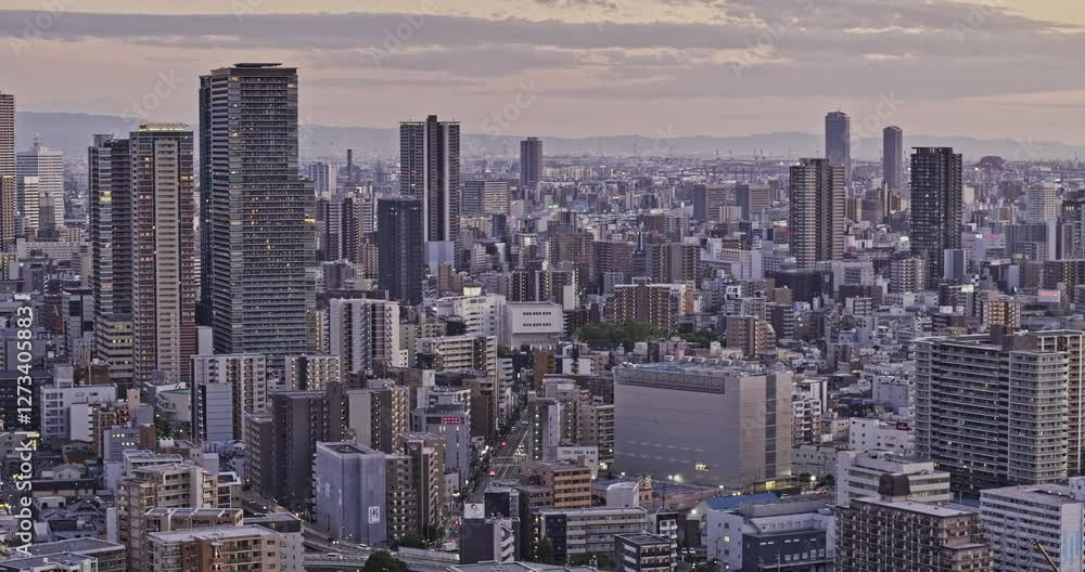 Osaka Japan Aerial v12 zoomed low flyover Oyodonaka capturing a densely populated downtown cityscape, with views of Fukushima and Kit wards at dusk - Shot with Mavic 3 Pro Cine - Oct 8th 2023 Osaka Japan Aerial v12 zoomed low flyover Oyodonaka capturing a densely populated downtown cityscape, with views of Fukushima and Kit wards at dusk - Shot with Mavic 3 Pro Cine - Oct 8th 2023
