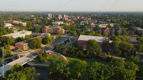 Michigan State University facilities surrounded with green trees, aerial view