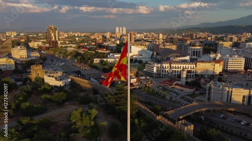 Aerial view of North Macedonian Flag blowing in the wind above Skopje fortress