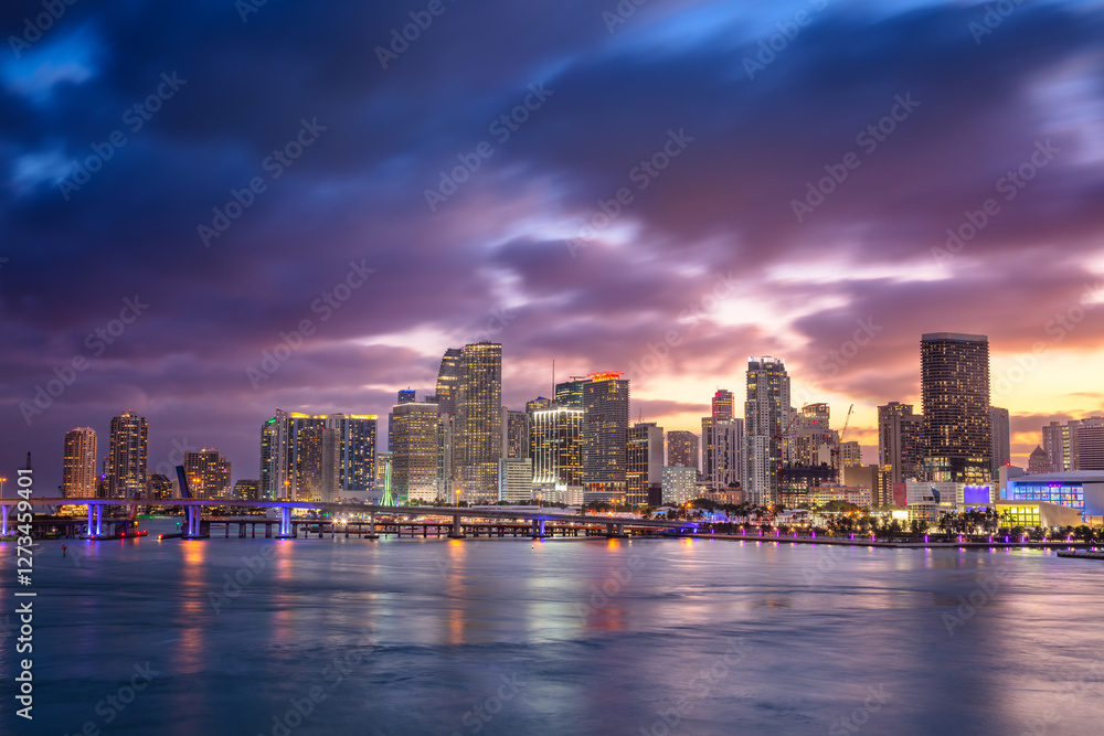 Miami, Florida, USA. Cityscape image of Miami, Florida with reflection of the city skyline in the water at beautiful sunset.