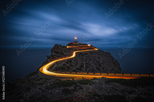 Wallpaper Mural Cap de Formentor with lighthouse in Mallorca at night. Balearic islands, Mallorca, Spain. Long exposure picture with light tracks of cars. Torontodigital.ca