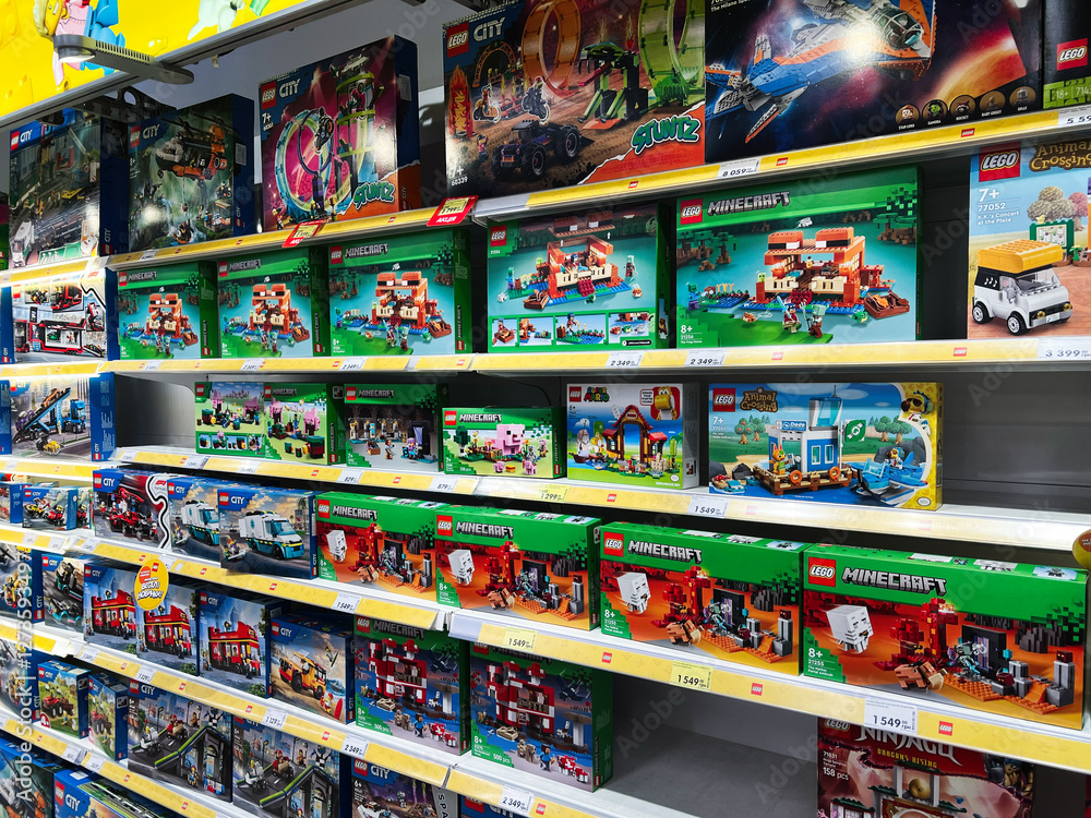 Fototapeta premium Lviv, Ukraine - February 16, 2025: Colorful display of toy building sets in a store with Lego themes
