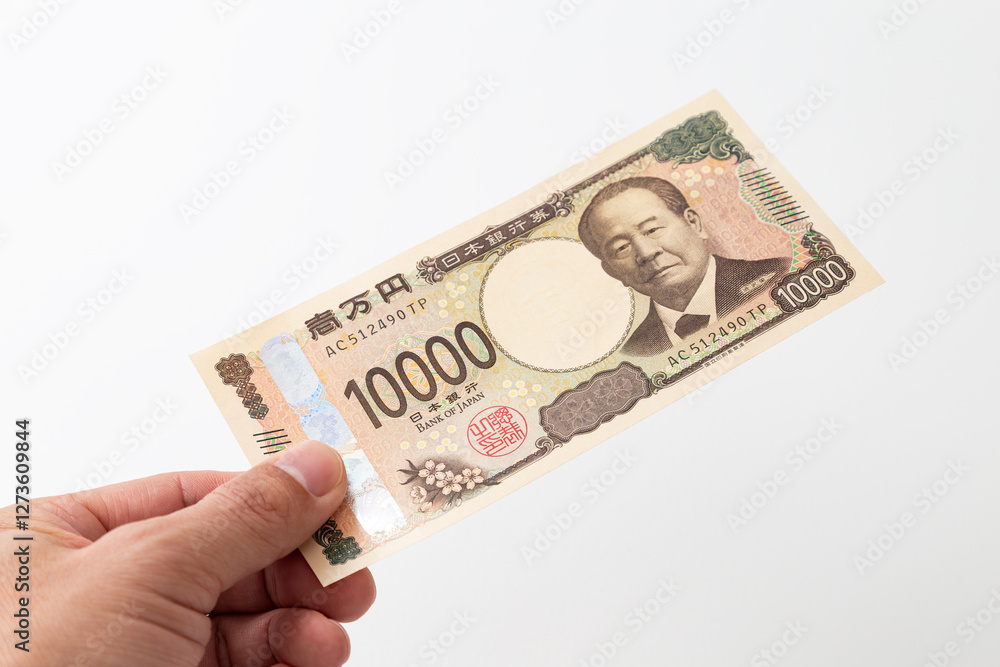 一万円札を持つ手元 一万円札を持つ手元