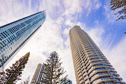 View from below of Q1, the tallest building on the Gold Coast, towering over other skyscrapers