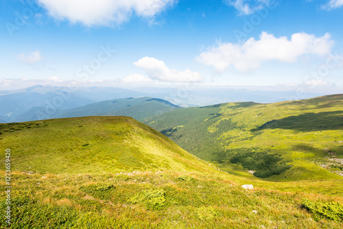 Obraz na płótnie scenic view in to the valley. natural environment. beautiful landscape of carpathian mountains on a bright forenoon in summer. grassy slopes beneath a blue sky. travel chornohora ridge of ukraine w salonie