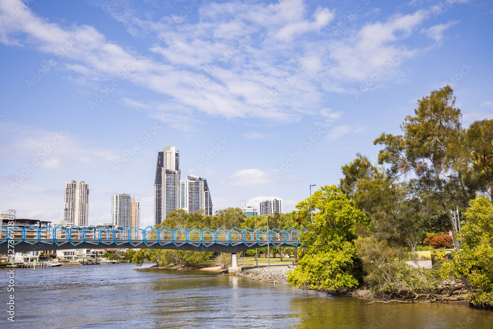 Blue footbridge walkway over the Nerang River at the Home of The Arts on the Gold Coast Blue footbridge walkway over the Nerang River at the Home of The Arts on the Gold Coast