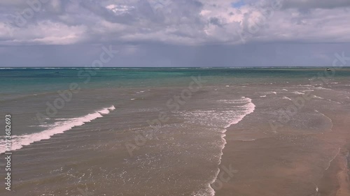 Wallpaper Mural Scenic view of waves and tourists having fun at Mambrui Beach in Malindi Town, Kilifi County, Kenya  Torontodigital.ca