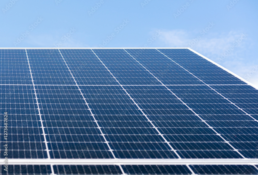 Low angle view of large blue solar panel with selective focus Low angle view of large blue solar panel with selective focus