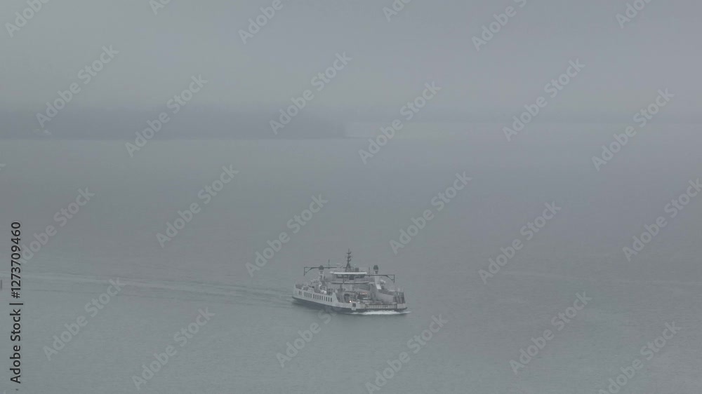 Drone view of a ship sailing in a misty weather Drone view of a ship sailing in a misty weather