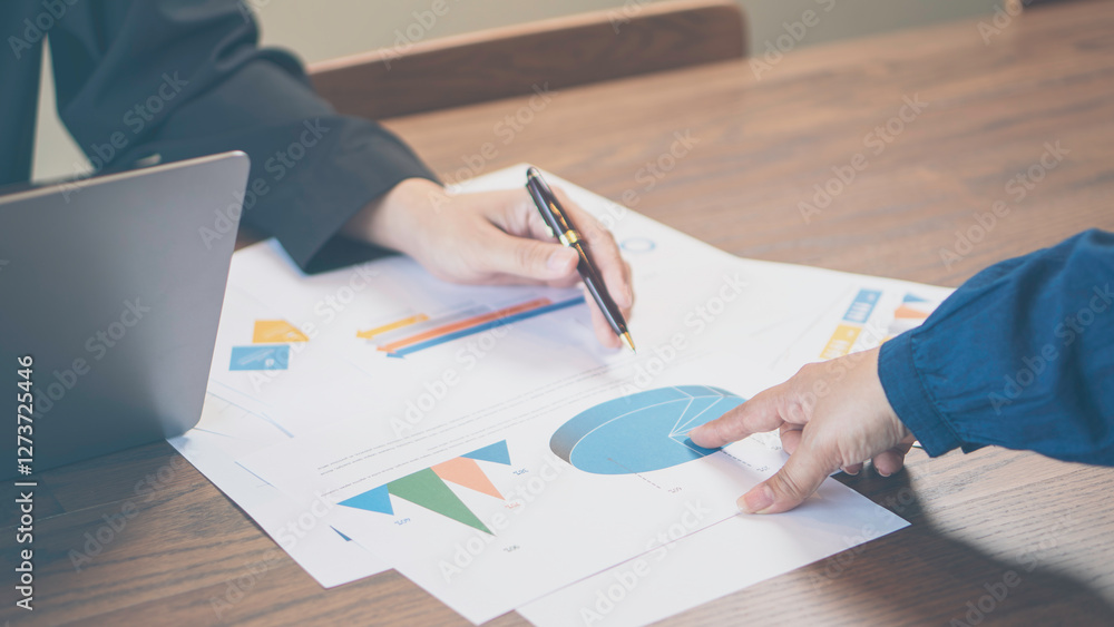 business collaboration, financial analysis, and teamwork, professionals reviewing financial reports and discussing data. The workspace, charts, and strategic documents, a corporate and analytical