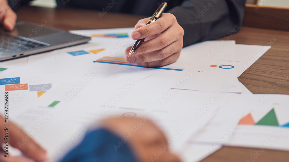 business collaboration, financial analysis, and teamwork, professionals reviewing financial reports and discussing data. The workspace, charts, and strategic documents, a corporate and analytical