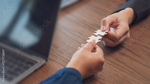 Obraz na płótnie teamwork, problem and collaboration, featuring two hands connecting puzzle pieces surface. the idea of partnership, strategy, and finding the right fit in both business and personal relationships. w salonie