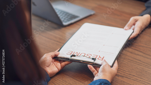 Obraz na płótnie job recruitment, hiring process and professional a candidate handing over a resume to an interviewer. a corporate and HR-related. The employment, career opportunities, and interview preparation. w salonie