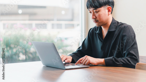 Obraz na płótnie remote work, digital productivity, and professional, a man in working on a laptop, online communication, and technology work. freelancing, business management, and remote job opportunities. w salonie