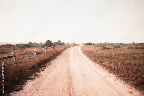 Dirt road crossing grassy fields leading to Cisco Beach photo