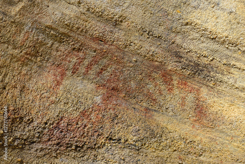 Close-up of prehistoric hand prints on rock