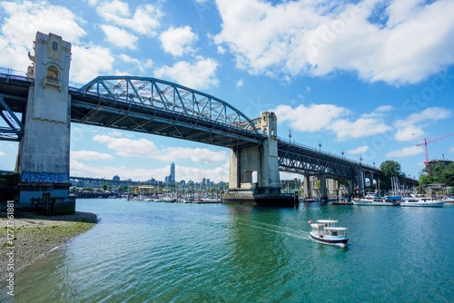 Burrard Bridge and boats on sunny day photo