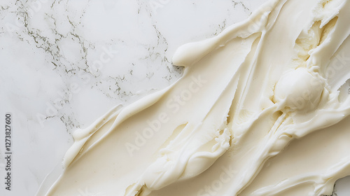 Creamy white spread, a delightful culinary abstract on a marble surface. Soft texture, smooth application.