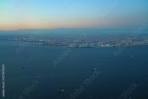 Aerial view of the Tokyo Bay, Japan, at nightfall in approach at Haneda Airport
