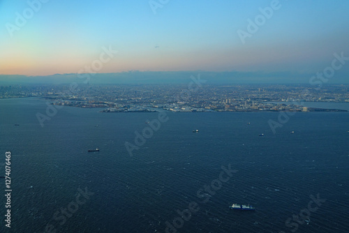 Photography Aerial view of the Tokyo Bay, Japan, at nightfall in approach at Haneda Airport