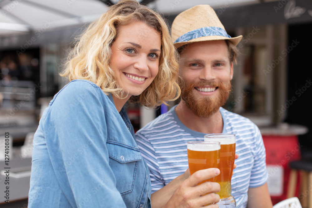 happy couple with beer outdoors